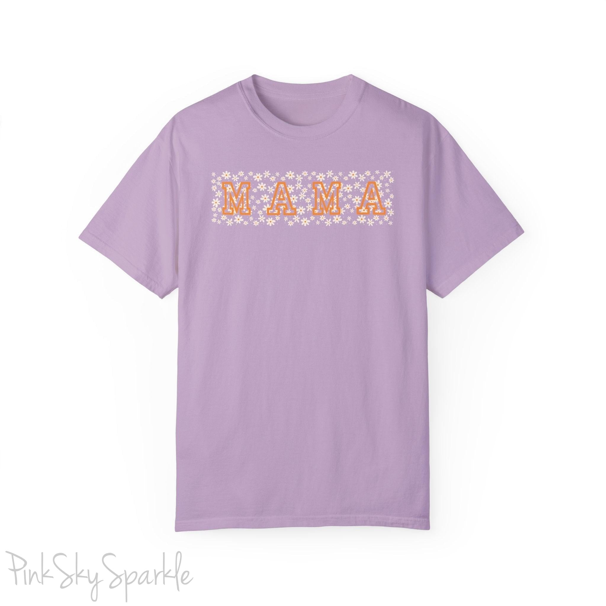 The bold 'MAMA' lettering, overlaid on a charming daisy pattern, makes this shirt a standout piece. Whether you're running errands, meeting friends for coffee, or just enjoying a quiet day at home, this t-shirt is your go-to for effortless style.&nbsp;