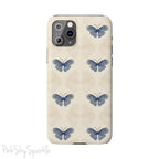 Add a touch of elegance to your phone with the Midnight Flutter Slim iPhone Case. Featuring a neutral background and navy blue butterflies.