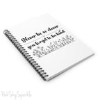Spiral notebook with the quote "Never be so clever you forget to be kind" and flowers on it.