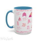 Pink Cozy Vibes Mug - Perfect for coffee, tea, or hot cocoa lovers! This ceramic mug features 'cozy vibes' in a pink font, surrounded by cute illustrations of pink cozy items such as slippers, mittens, blankets and candles. Ideal for creating a warm, cozy atmosphere, this pink-handled mug (also available in light blue, black and navy) makes a great gift for anyone who loves comfort, style and the color pink.
