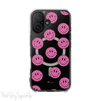 Clear magnetic phone case featuring pink checkered smiley faces on a transparent background, designed for MagSafe® compatibility with air-cushioned bumper corners.