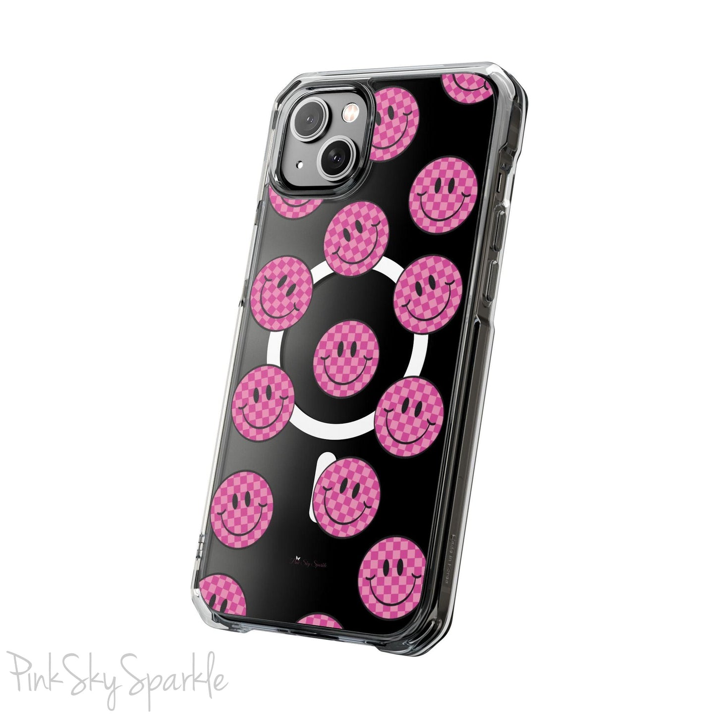 Clear magnetic phone case featuring pink checkered smiley faces on a transparent background, designed for MagSafe® compatibility with air-cushioned bumper corners.