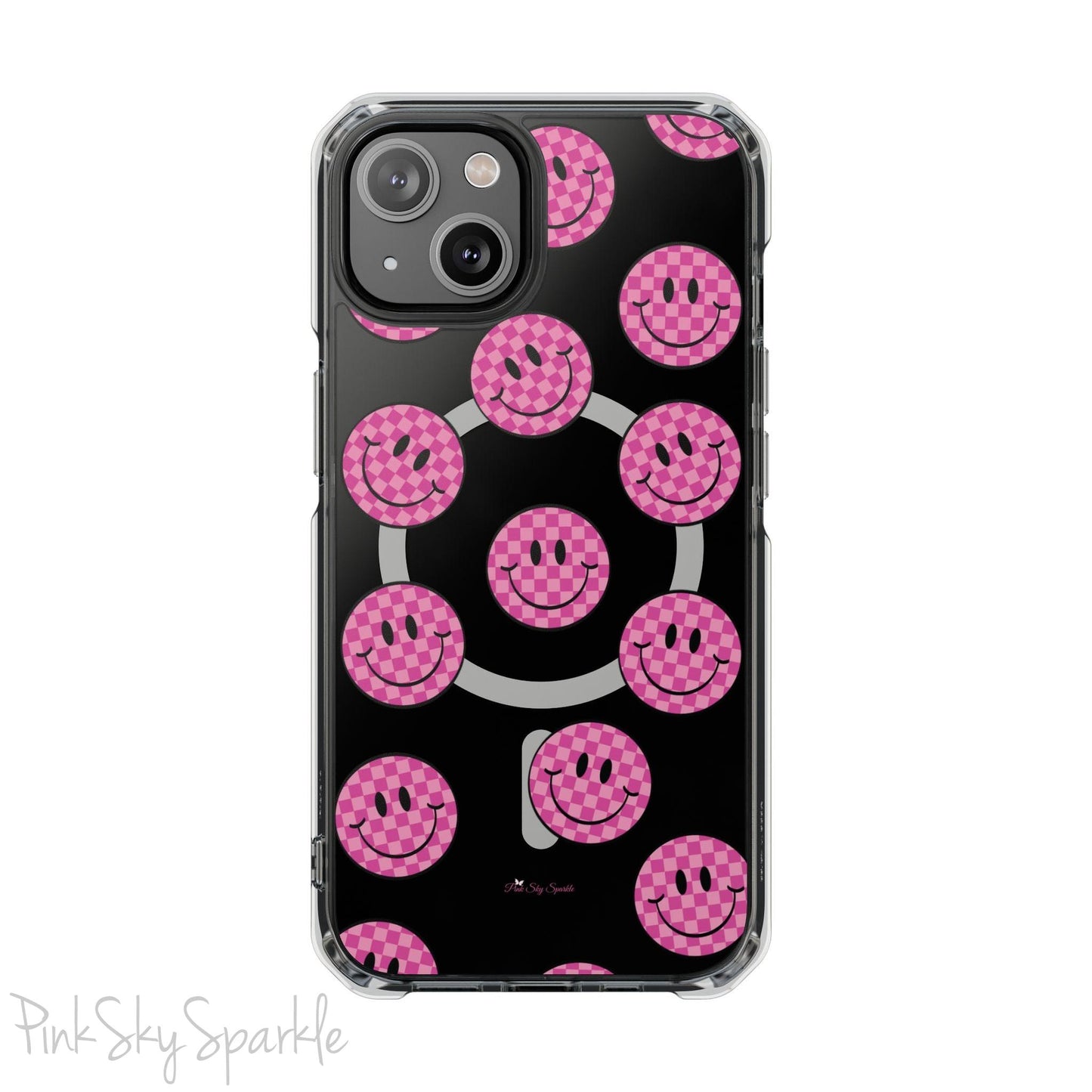 Clear magnetic phone case featuring pink checkered smiley faces on a transparent background, designed for MagSafe® compatibility with air-cushioned bumper corners.
