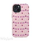 Pink Tough Magnetic iPhone Case with a pink and purple Halloween candy pattern. 