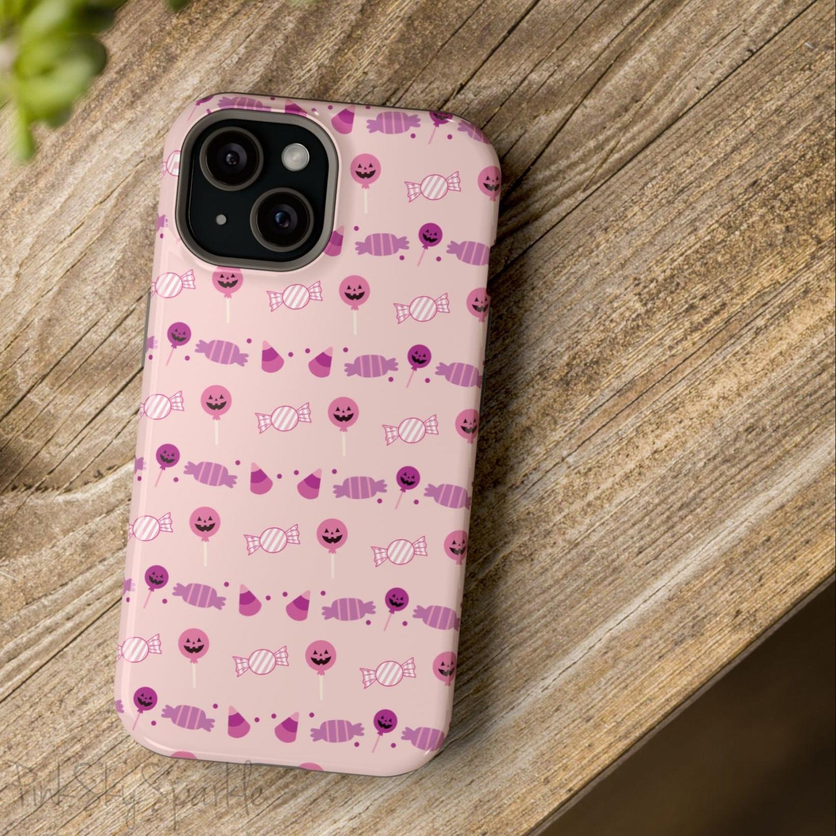 Pink Tough Magnetic iPhone Case with a pink and purple Halloween candy pattern. 