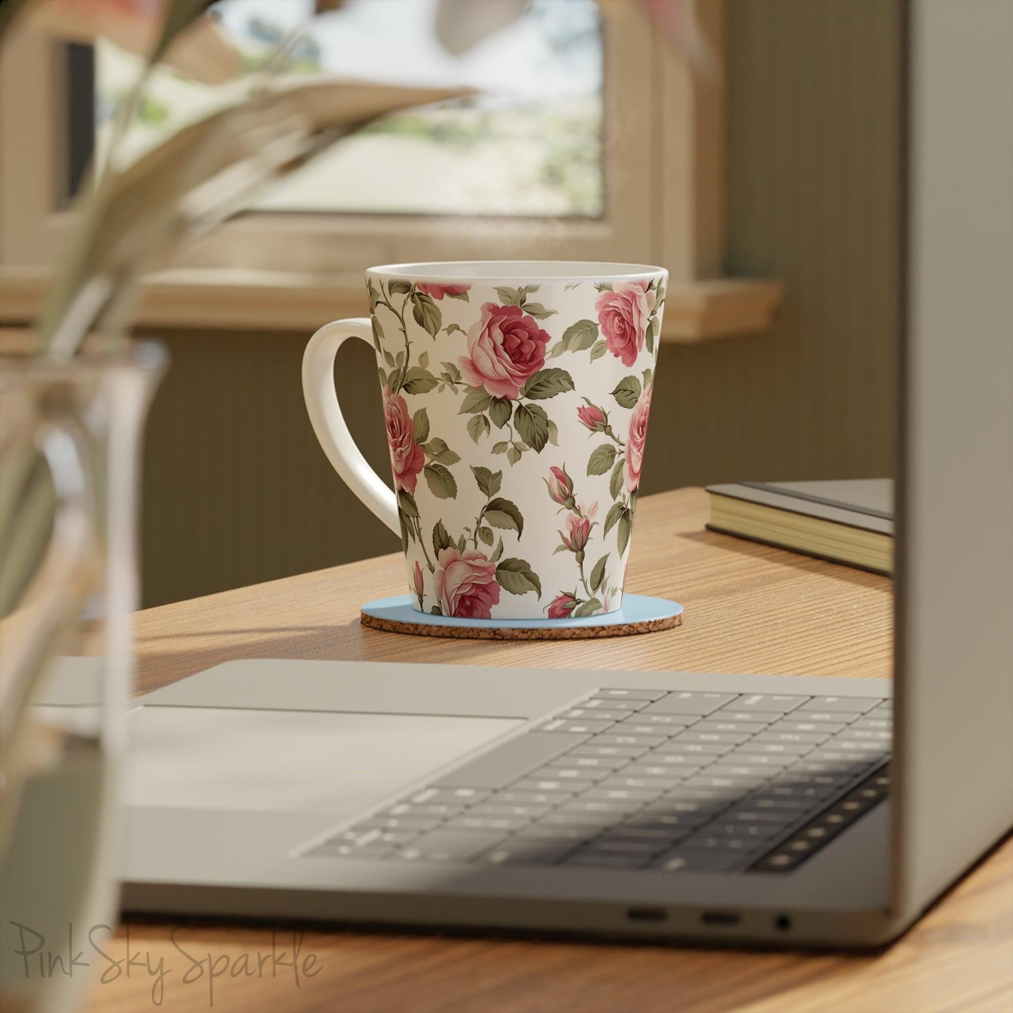Rose Garden Latte Mug. A white mug with a rose vine print on an ivory coloured background.