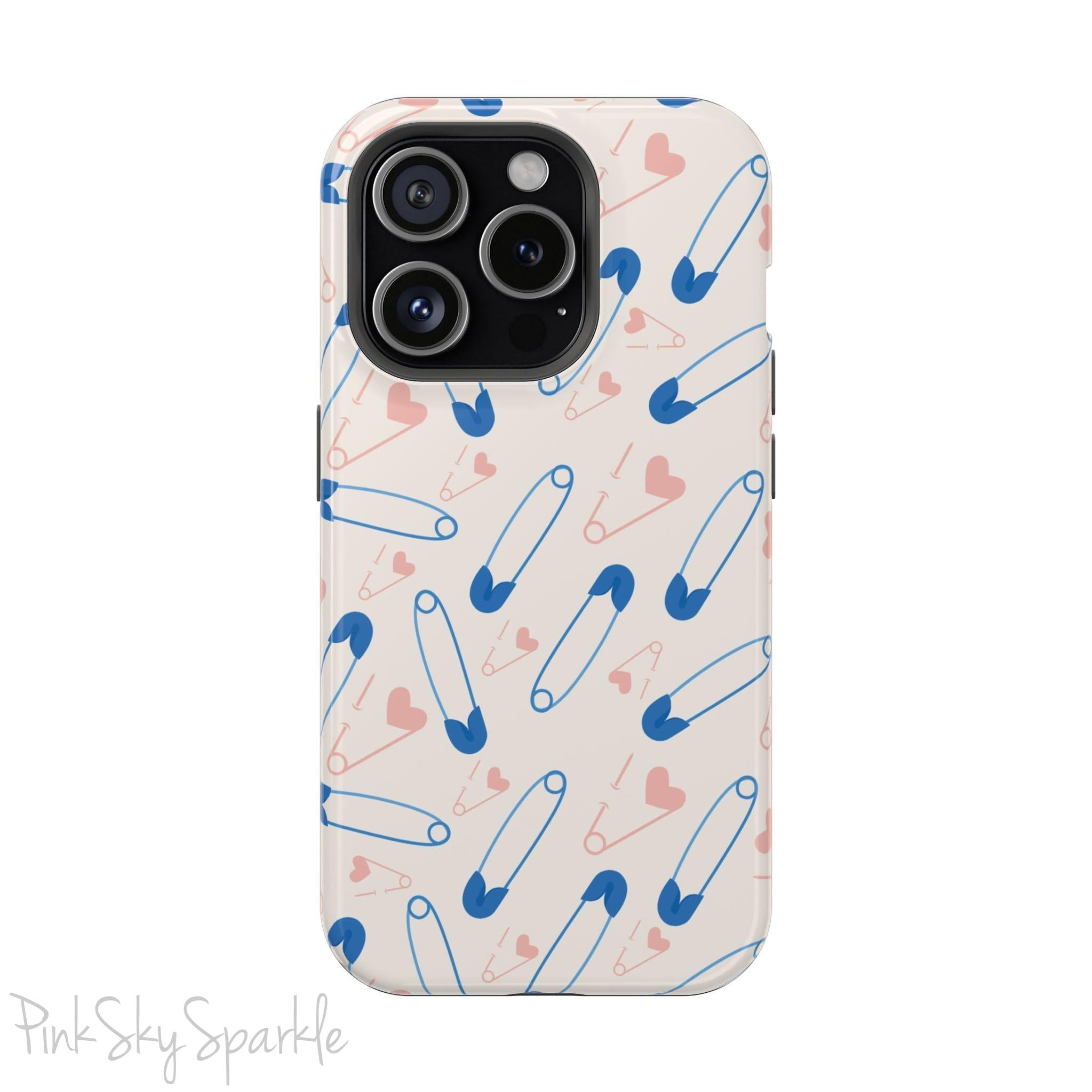 Make a statement with the Safety Pin Magnetic iPhone Case. Featuring a sleek design of blue safety pins, this case adds unique flair while providing durable protection for iPhone models 13, 14, 15, and 16.