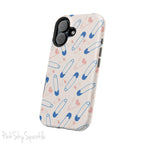Make a statement with the Safety Pin Magnetic iPhone Case. Featuring a sleek design of blue safety pins, this case adds unique flair while providing durable protection for iPhone models 13, 14, 15, and 16.