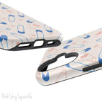 Make a statement with the Safety Pin Magnetic iPhone Case. Featuring a sleek design of blue safety pins, this case adds unique flair while providing durable protection for iPhone models 13, 14, 15, and 16.