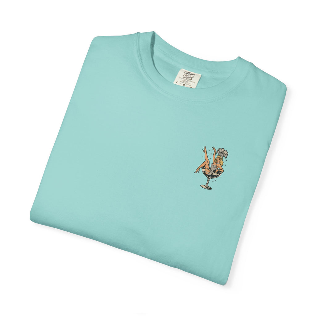Folded chalky mint coloured t-shirt with a graphic design on a white background