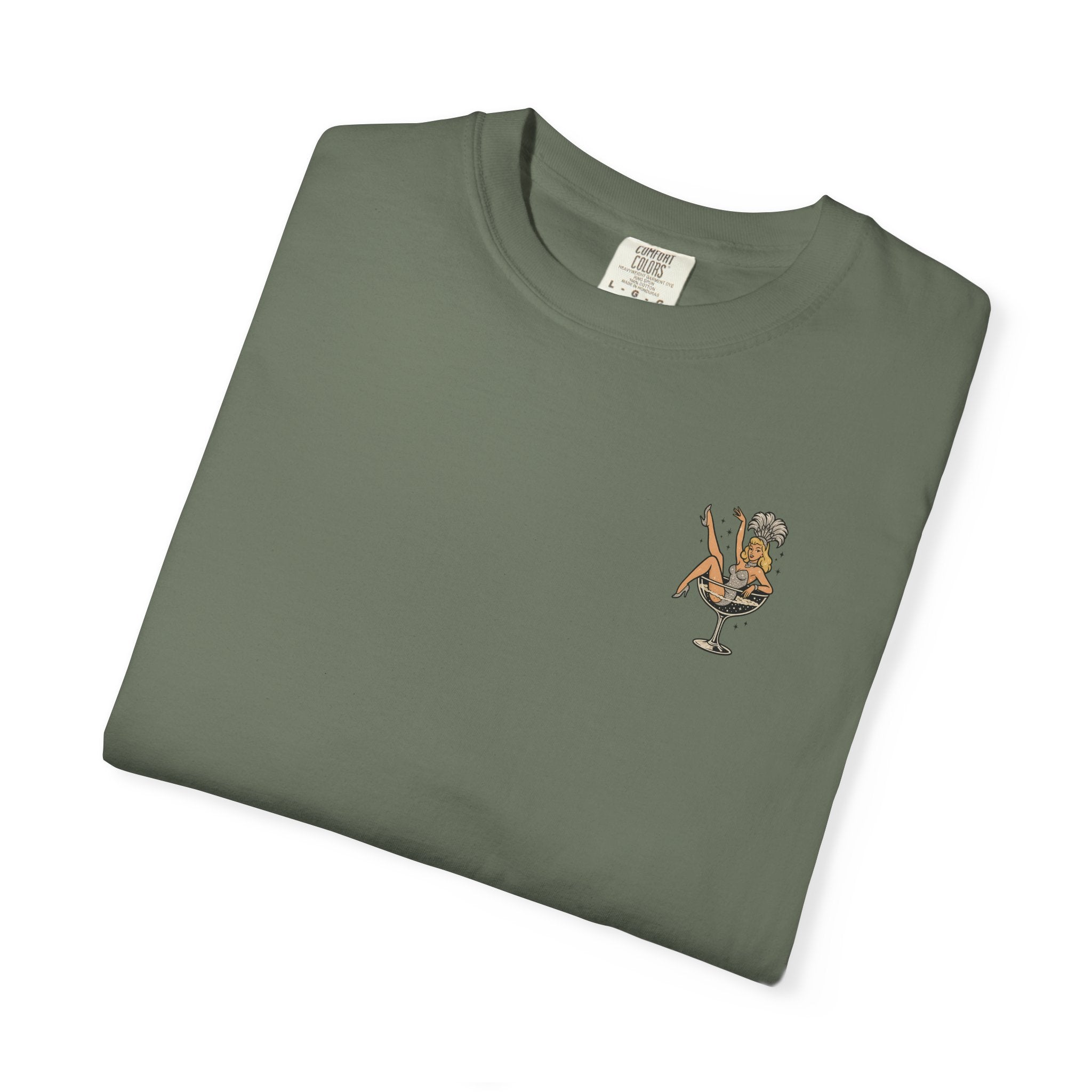Folded green t-shirt with a small showgirl graphic on a white background