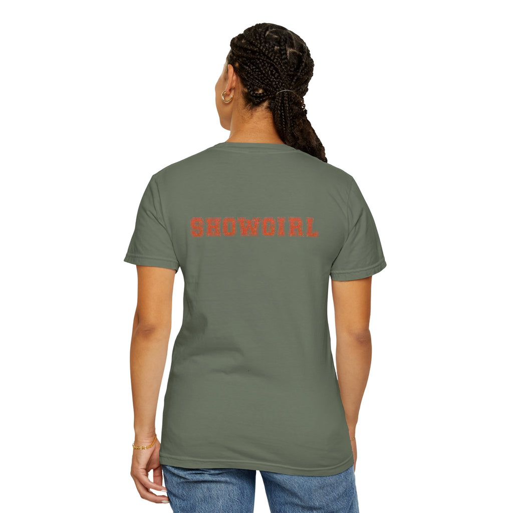 Person wearing a green t-shirt with 'SHOWGIRL' printed on the back, on a white background