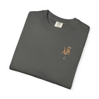 Folded gray t-shirt with a small showgirl graphic on a white background