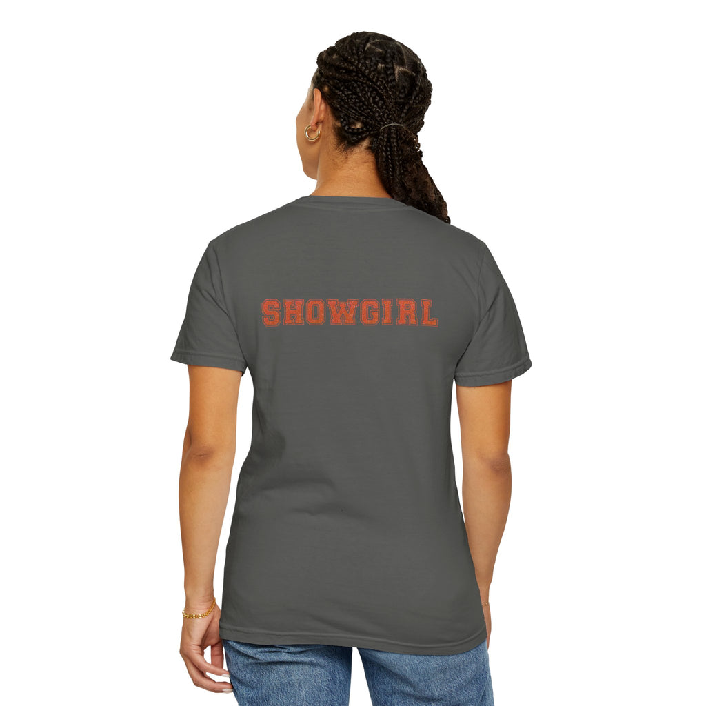 Person wearing a gray t-shirt with 'SHOWGIRL' printed on the back, on a white background