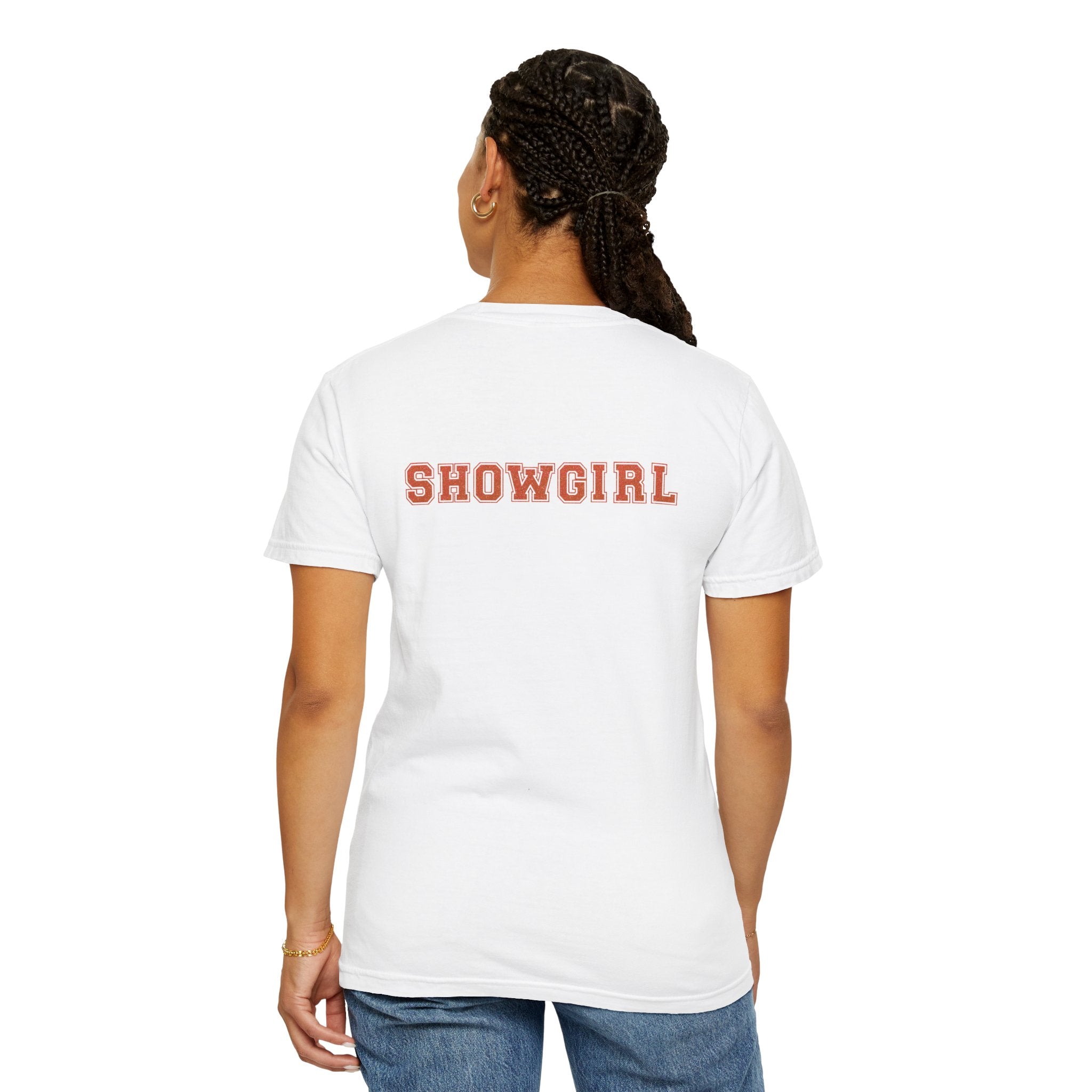 Person wearing a white t-shirt with 'SHOWGIRL' printed on the back against a white background