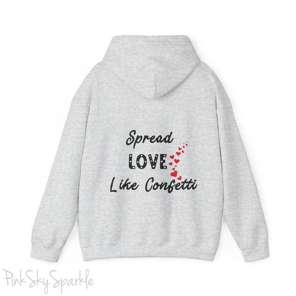 Cozy sweatshirt with the uplifting message “Spread Love Like Confetti” in bold, stylish font.