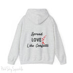 Cozy sweatshirt with the uplifting message “Spread Love Like Confetti” in bold, stylish font.
