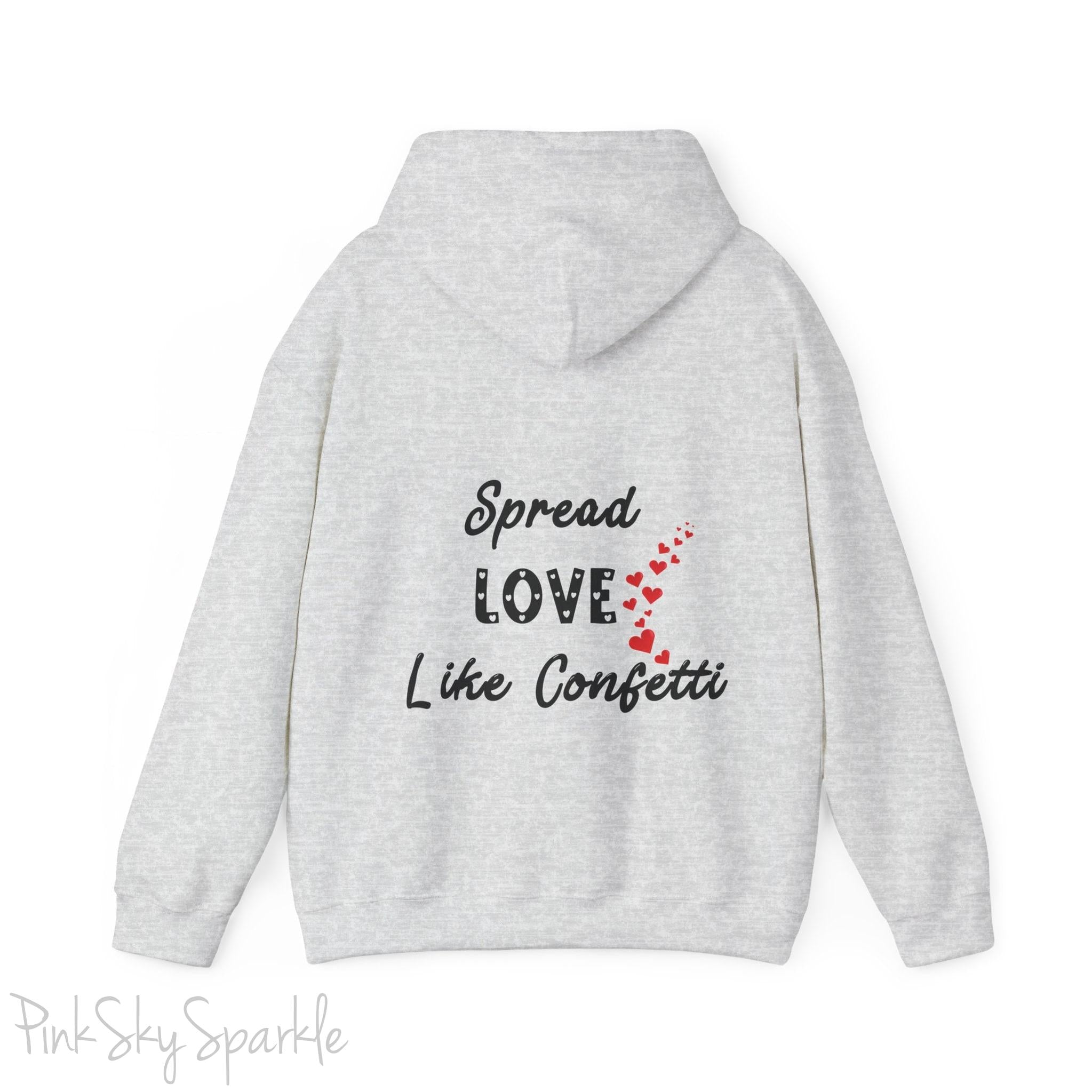 Cozy sweatshirt with the uplifting message “Spread Love Like Confetti” in bold, stylish font.