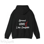 Cozy sweatshirt with the uplifting message “Spread Love Like Confetti” in bold, stylish font.