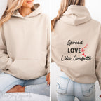 Cozy sweatshirt with the uplifting message “Spread Love Like Confetti” in bold, stylish font.