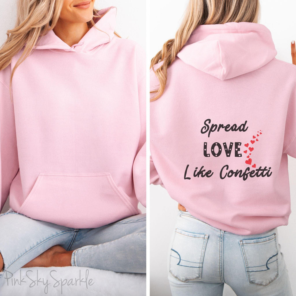 Cozy sweatshirt with the uplifting message “Spread Love Like Confetti” in bold, stylish font.