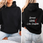 Cozy sweatshirt with the uplifting message “Spread Love Like Confetti” in bold, stylish font.