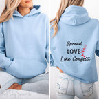Cozy sweatshirt with the uplifting message “Spread Love Like Confetti” in bold, stylish font.