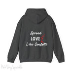 Cozy sweatshirt with the uplifting message “Spread Love Like Confetti” in bold, stylish font.