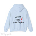 Cozy sweatshirt with the uplifting message “Spread Love Like Confetti” in bold, stylish font.