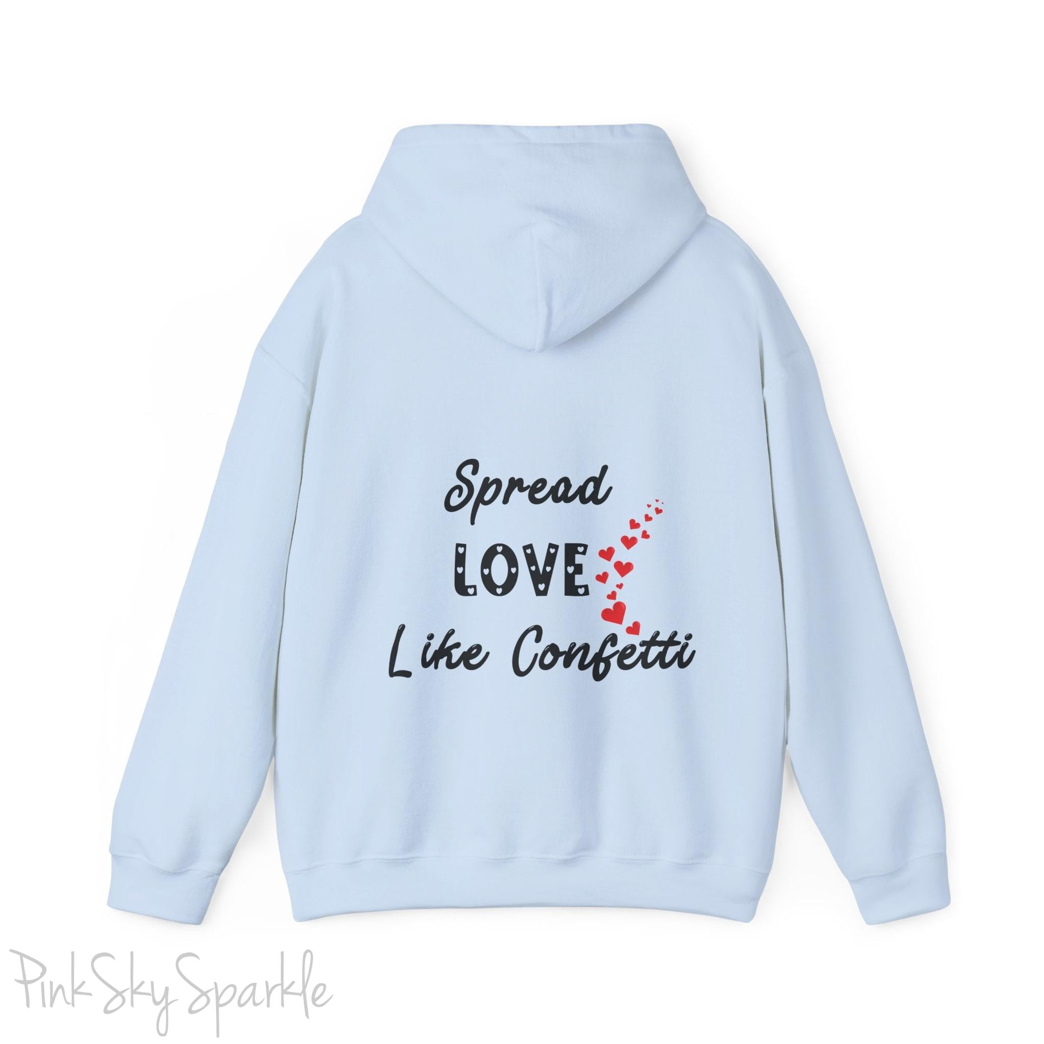 Cozy sweatshirt with the uplifting message “Spread Love Like Confetti” in bold, stylish font.