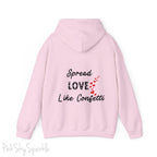 Cozy sweatshirt with the uplifting message “Spread Love Like Confetti” in bold, stylish font.