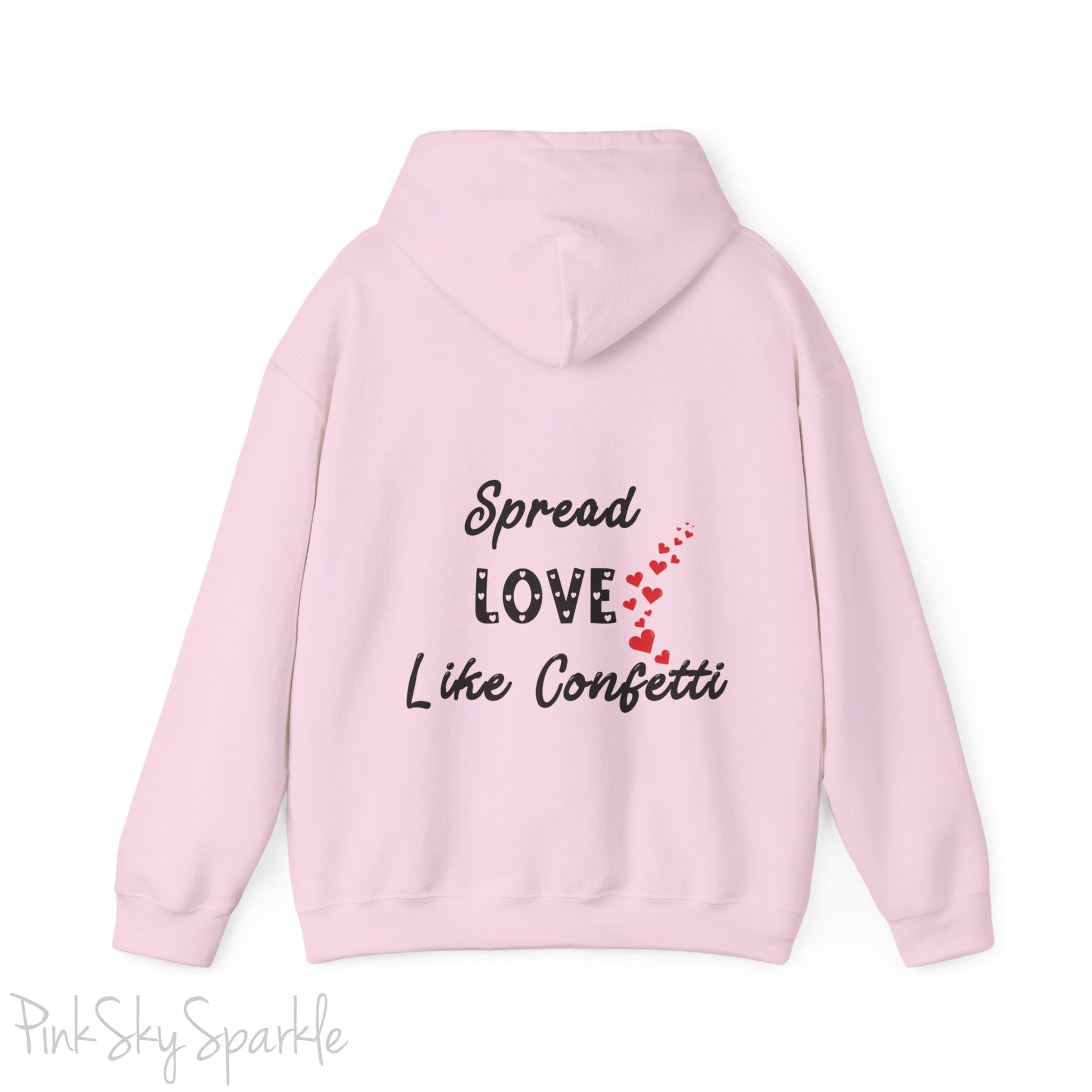 Cozy sweatshirt with the uplifting message “Spread Love Like Confetti” in bold, stylish font.