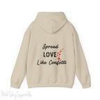 Cozy sweatshirt with the uplifting message “Spread Love Like Confetti” in bold, stylish font.