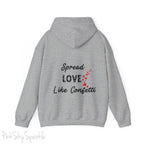 Cozy sweatshirt with the uplifting message “Spread Love Like Confetti” in bold, stylish font.