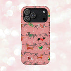 iPhone case with holiday dogs in sweaters on pink background.