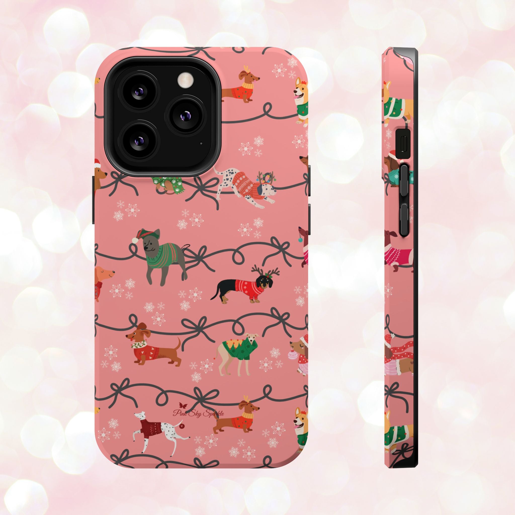iPhone case with holiday dogs in sweaters on pink background.
