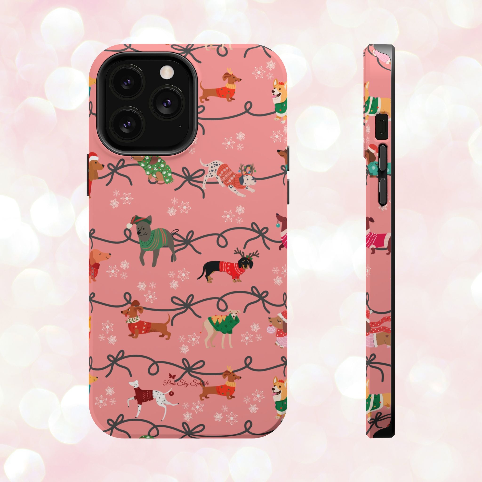 iPhone case with holiday dogs in sweaters on pink background.