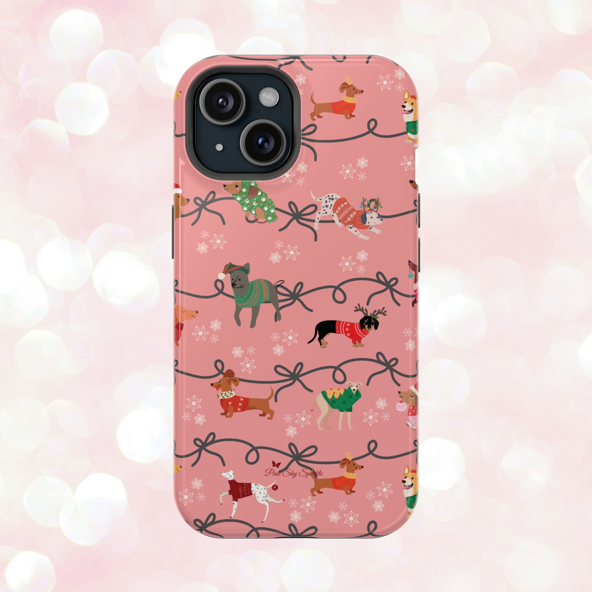 iPhone case with holiday dogs in sweaters on pink background.