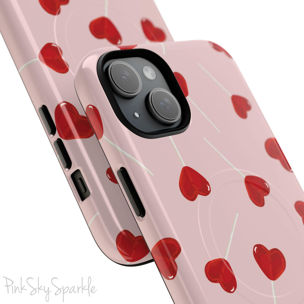 Pink phone case with red heart-shaped lollipop designs, perfect for Valentine’s Day or a playful aesthetic.