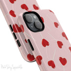 Pink phone case with red heart-shaped lollipop designs, perfect for Valentine’s Day or a playful aesthetic.