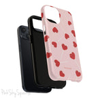 Pink phone case with red heart-shaped lollipop designs, perfect for Valentine’s Day or a playful aesthetic.