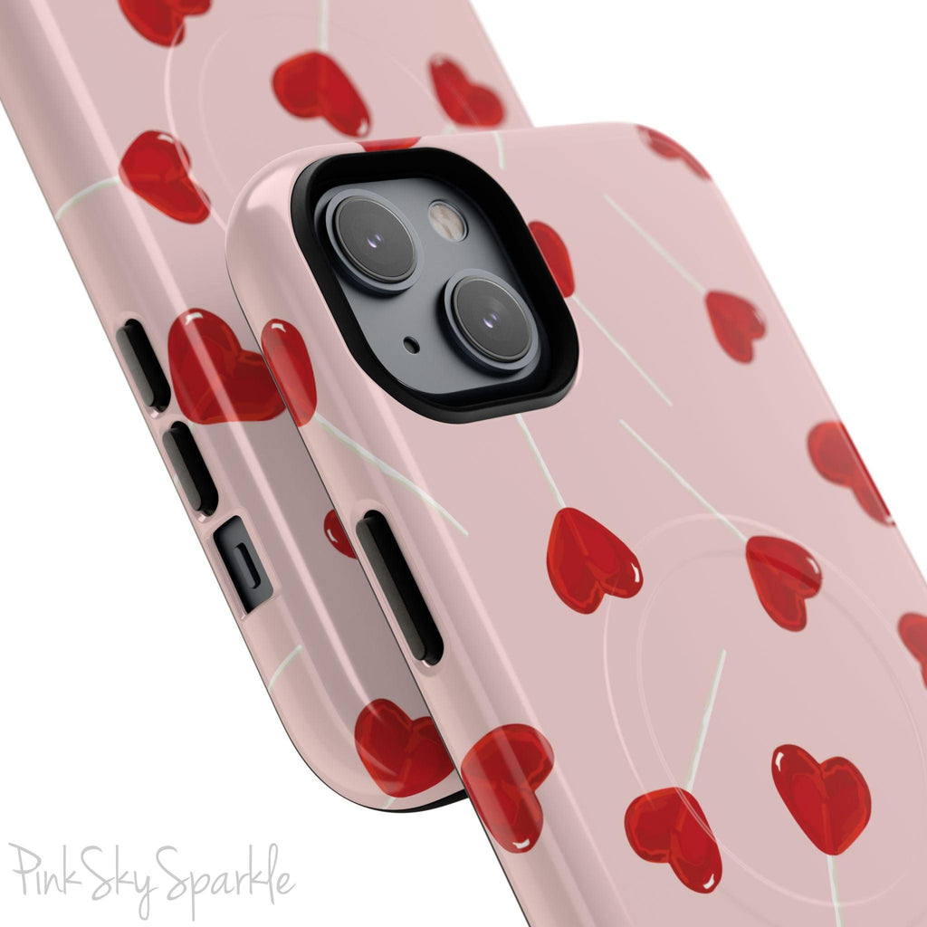 Pink phone case with red heart-shaped lollipop designs, perfect for Valentine’s Day or a playful aesthetic.