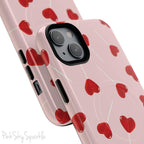 Pink phone case with red heart-shaped lollipop designs, perfect for Valentine’s Day or a playful aesthetic.