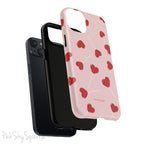 Pink phone case with red heart-shaped lollipop designs, perfect for Valentine’s Day or a playful aesthetic.