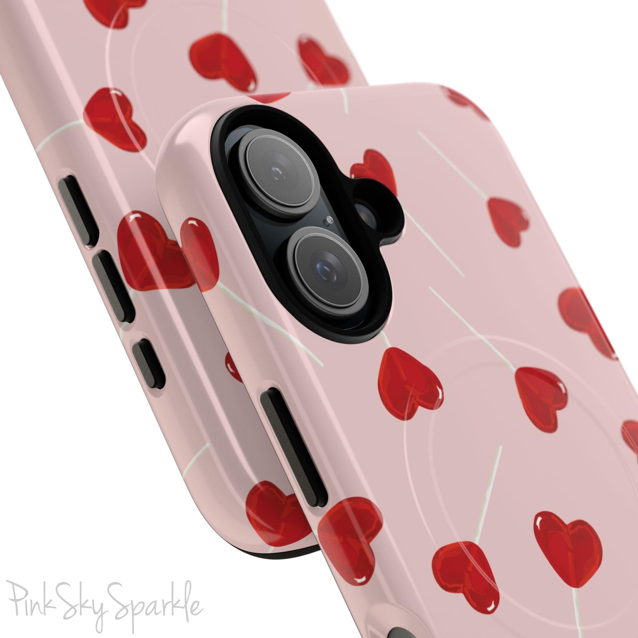 Pink phone case with red heart-shaped lollipop designs, perfect for Valentine’s Day or a playful aesthetic.