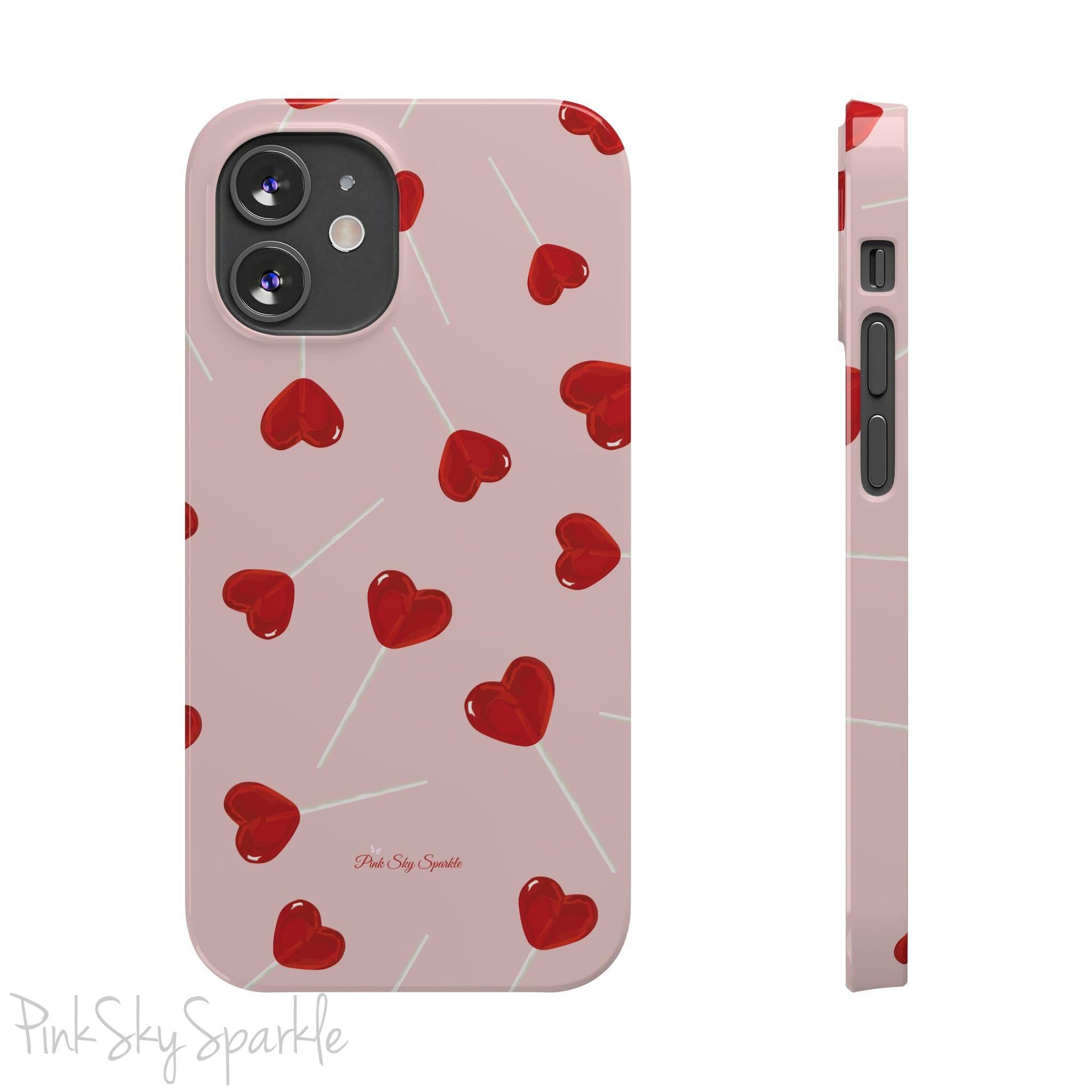 Pink phone case with red heart-shaped lollipop designs, perfect for Valentine’s Day or a playful aesthetic.