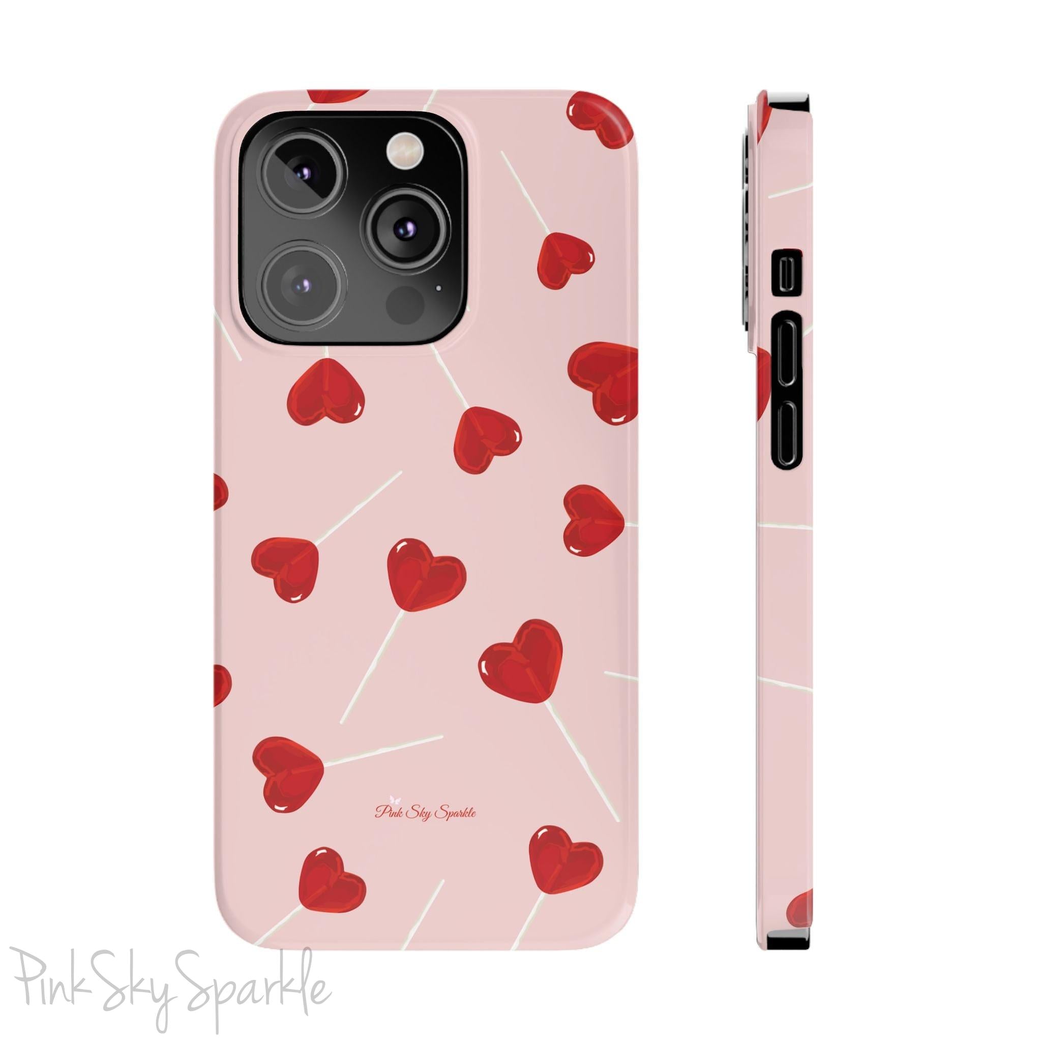 Pink phone case with red heart-shaped lollipop designs, perfect for Valentine’s Day or a playful aesthetic.