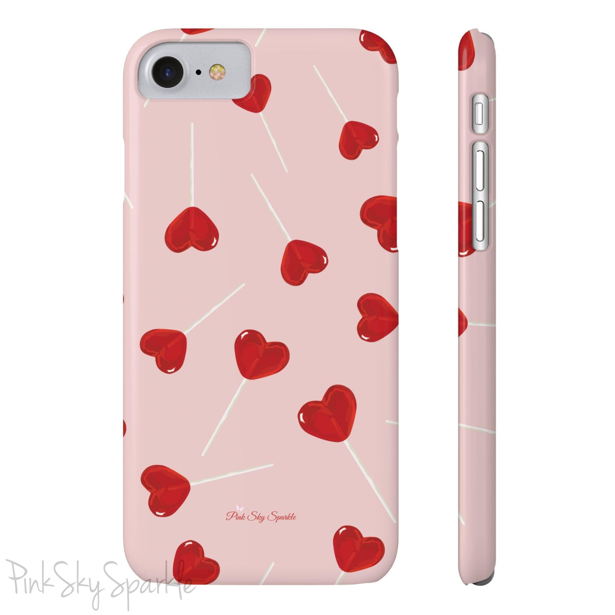 Pink phone case with red heart-shaped lollipop designs, perfect for Valentine’s Day or a playful aesthetic.
