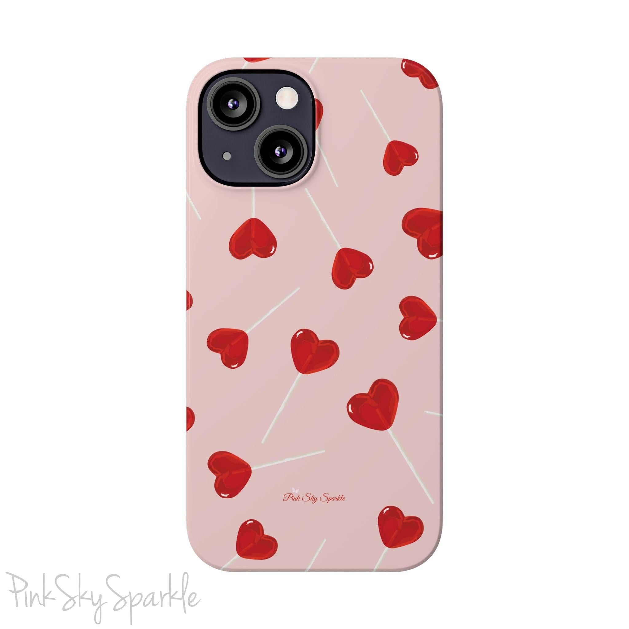 Pink phone case with red heart-shaped lollipop designs, perfect for Valentine’s Day or a playful aesthetic.