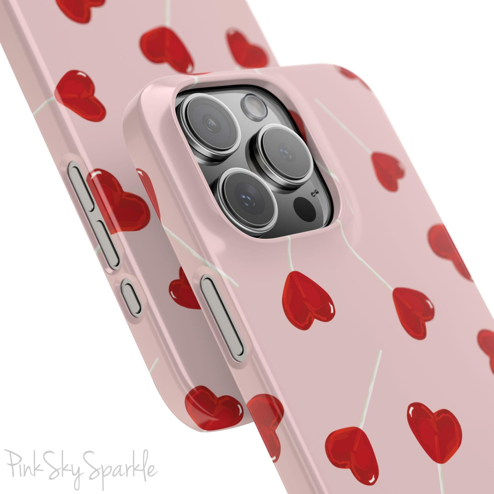 Pink phone case with red heart-shaped lollipop designs, perfect for Valentine’s Day or a playful aesthetic.